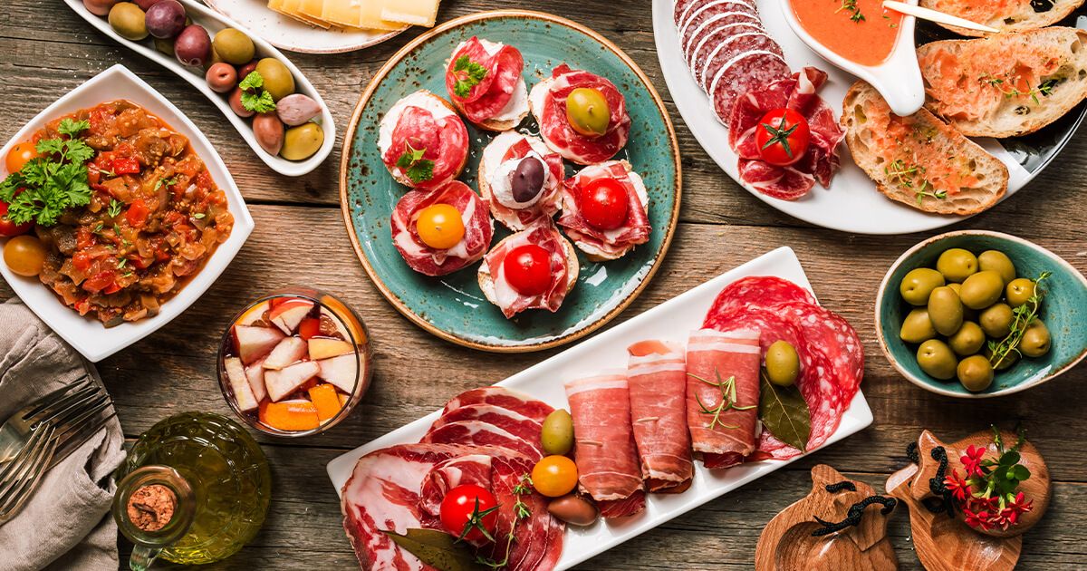 Variety of Spanish tapas on plates.